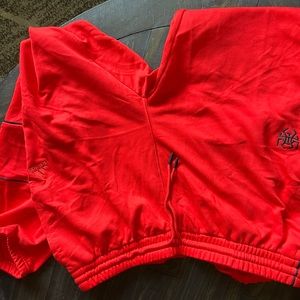 Red Adidas sweatpants
